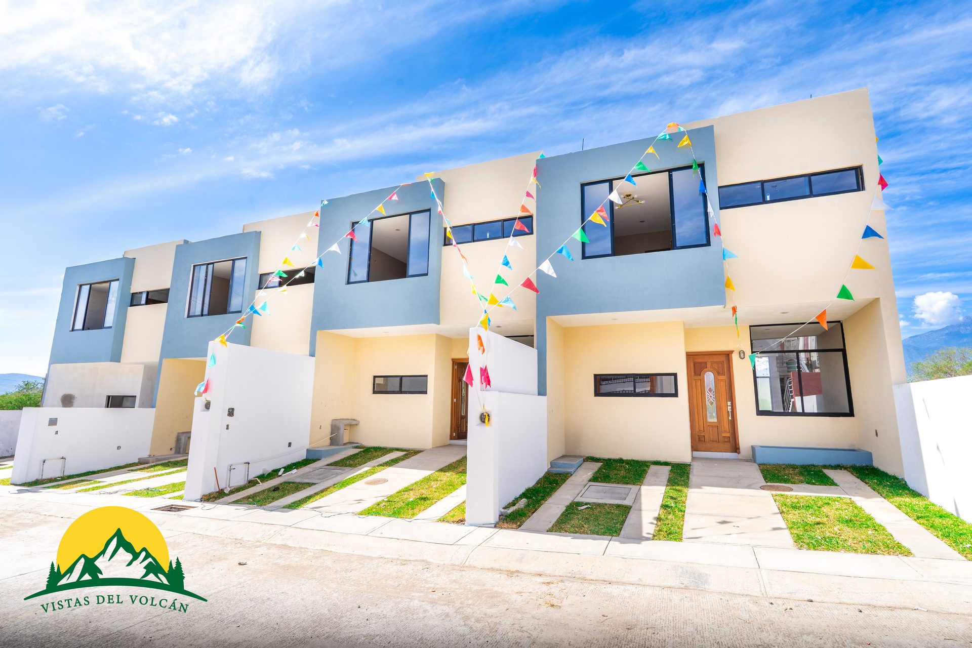 Fachada de casas modelo Fresa Plus en Vistas del Volcán